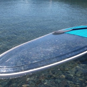 a close up of a boat next to a body of water