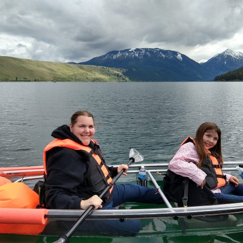 ladies on a paddleboat on the water