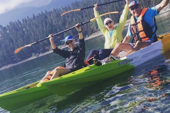 a group of people riding on the back of a boat