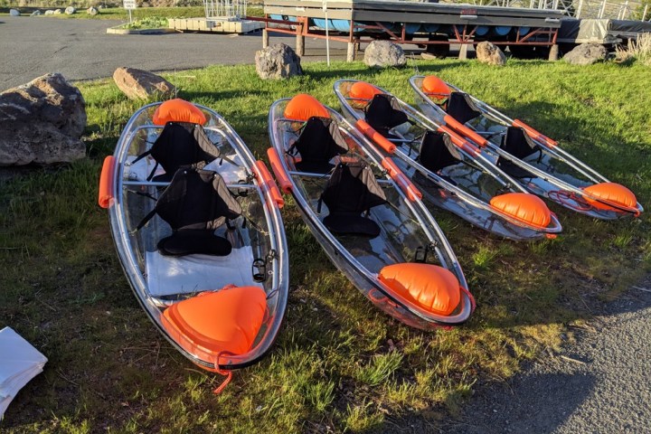a group of lawn chairs sitting on top of a tent