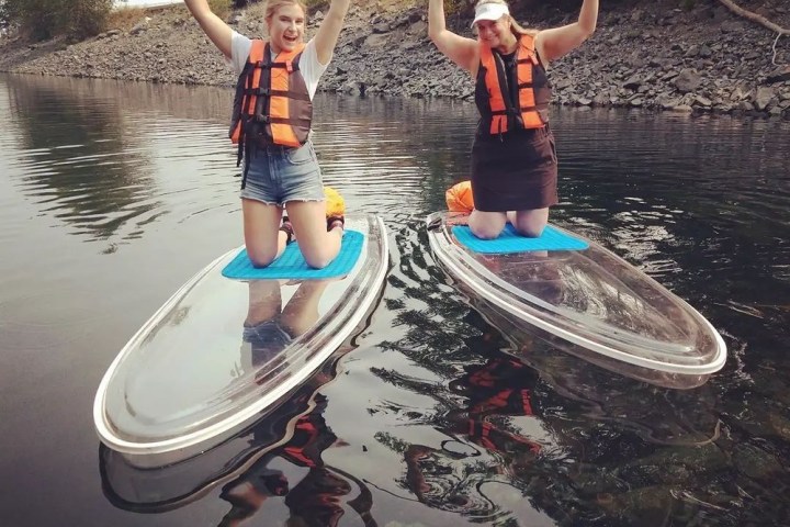 a person riding on the back of a boat in the water