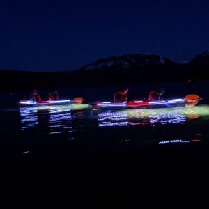 a group of fireworks in the sky over a body of water
