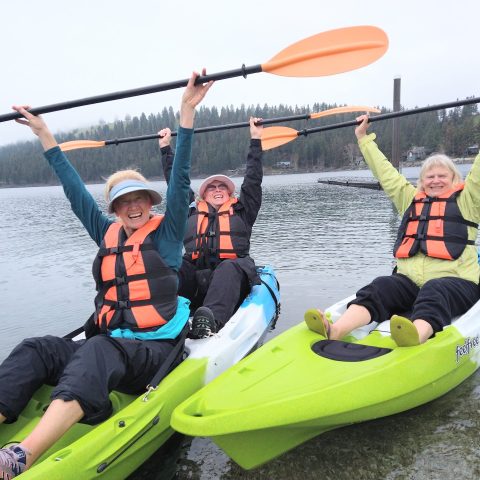 a group of people on a raft in a body of water